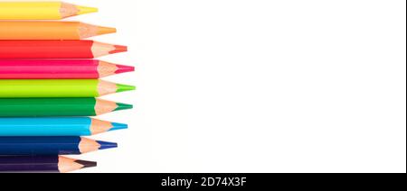 Colored pencils in a circle, white background, top view Stock Photo