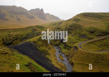 Stream cuts through the green mossy hills in Iceland Stock Photo