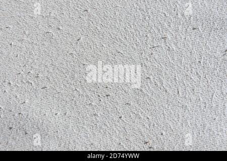 Cotton beige fabric surface texture with pills traces of wear, outdated, used Stock Photo