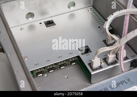CATV system hanging on black optical fiber cables for amplify TV signals installed with coaxial cables Stock Photo
