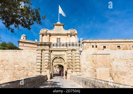 Mdina Gate the main entrance to the Maltese fortified city. Also known as Vilhena Gate. Architecture is in  baroque style. Stock Photo