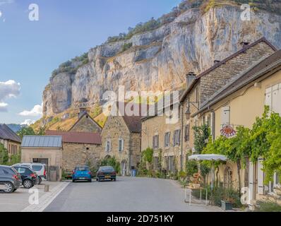 Baume-Les-Messieurs, France - 09 01 2020: View of the village of Baume-les-Messieurs and cliffs behind Stock Photo