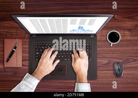 Using laptop with a cup of coffee Stock Photo
