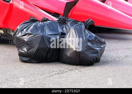 https://l450v.alamy.com/450v/2d753gy/garbage-plastic-black-bags-waste-at-walkway-community-village-plastic-bags-of-waste-2d753gy.jpg