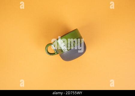 porcelain coffee cups on yellow background Stock Photo