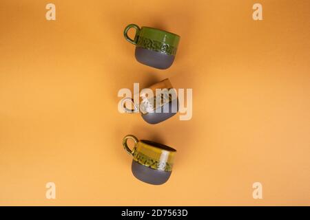 porcelain coffee cups on yellow background Stock Photo