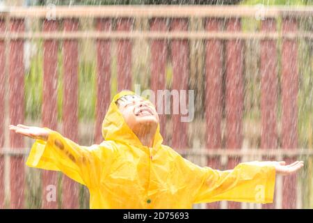 Boy Wearing Yellow Rain Coat Smiling while Fishing Stock Photo - Image of  lake, rest: 156648746