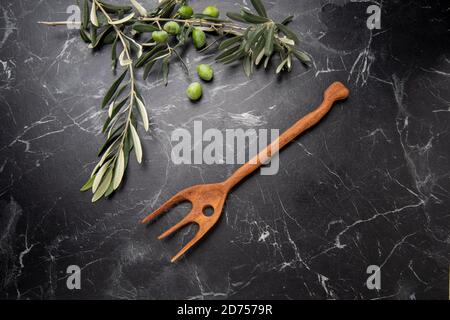 hand crafted wooden fork in the kitchen Stock Photo