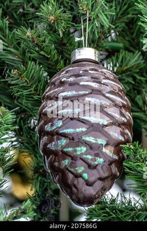 New Year's toys on a Christmas tree on a city street. Festive mood. Stock Photo