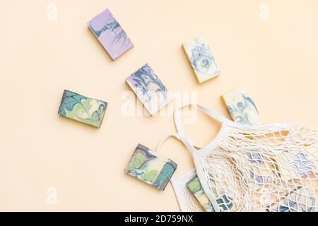 String bag or mesh bag with natural hand made soap. Zero waste, eco friendly cosmetics concept. Stock Photo