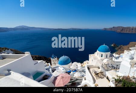 Beautiful panoramic view of Santorini caldera with famous old blue domes of orthodox churches Stock Photo