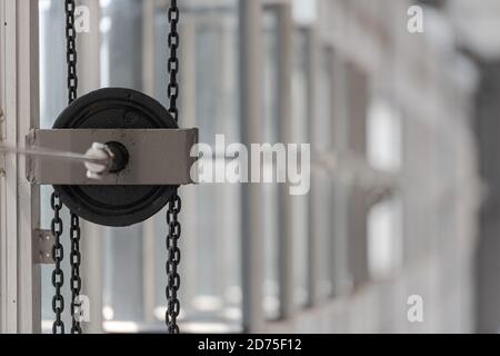 Chain pull for opening and closing big windows in the Bauhaus Dessau Stock Photo