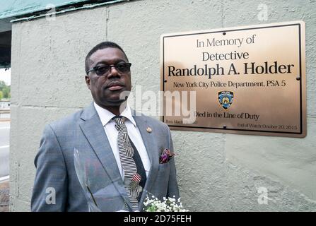 New York, United States. 20th Oct, 2020. Father of Randolph Holder attends bridge name dedication and plaque installation in memory of his son in Harlem, New York on October 20, 2020. Pedestrian footbridge over Franklin D. Roosevelt Drive at 120th Street where officer Holder was killed in 2015 connects Harlem streets and public bike and walkway along Harlem river. (Photo by Lev Radin/Sipa USA) Credit: Sipa USA/Alamy Live News Stock Photo