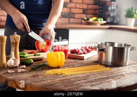 Man preparing delicious and healthy food in the home kitchen Stock Photo