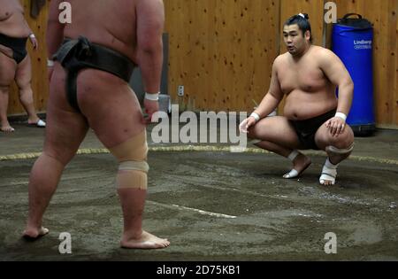 Japanese Sumo wrestlers training inside a traditional Sumo stable in early morning.Koto City.Tokyo.Japan Stock Photo