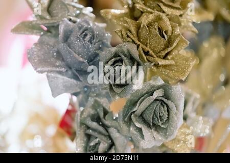Gold and silver christmas decorations on blurred background. Stock Photo