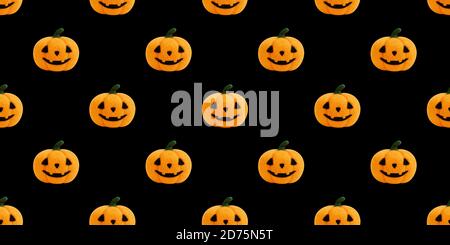 Seamless pattern with Halloween pumpkin on black background. Jack's head background. Toy Halloween pumpkin made of wool. Concept for packaging design. Stock Photo