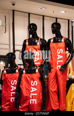 Mannequins for selling clothes in a shopping center. Big seasonal sale. Stock Photo