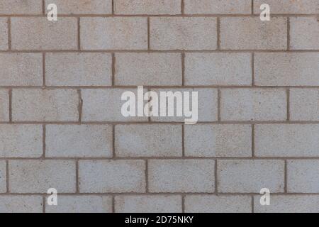 Old vintage brick wall textures for background. Yellow brown wall of Israel houses. Texture of old rock. Aged grunge concrete blocks texture. Concrete Stock Photo
