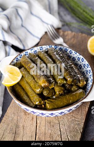 stuffed vine leaves with lemon/sarma/dolma from Turkish and Greek cuisine. Stock Photo