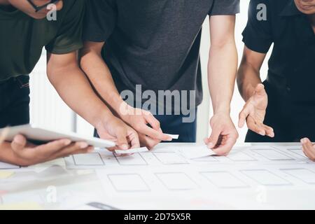 Programmer and UX UI designer working in a software development and coding technologies. Mobile and website design and programing development technolo Stock Photo