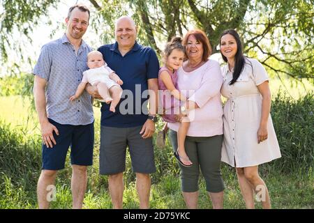 family relaxing together in nature with grandparent Stock Photo