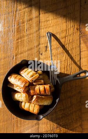 High Angle View of Apple Pastries with Fork in Cast Iron Skillet Stock Photo