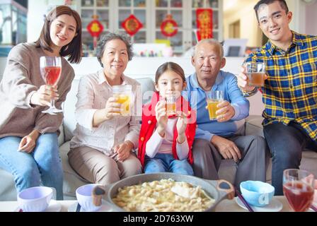 happy asian family having dinner and celebrating chinese new year at home Stock Photo