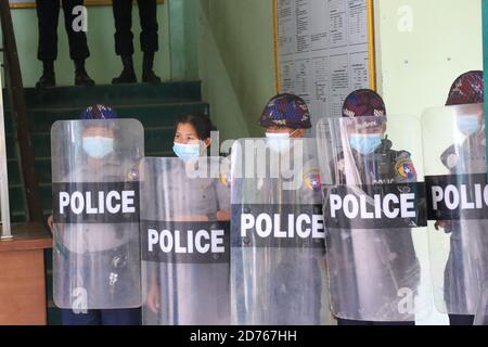 Mandalay, Myanmar. 20th Oct, 2020. Police standing on guard in front of the ladder before Kyaw Myint came down.The United Democratic party chairman, U Kyaw Myint who was arrested for absconding, was arraigned for the third time in Chan Aye Thar Zan Township Court. Credit: SOPA Images Limited/Alamy Live News Stock Photo