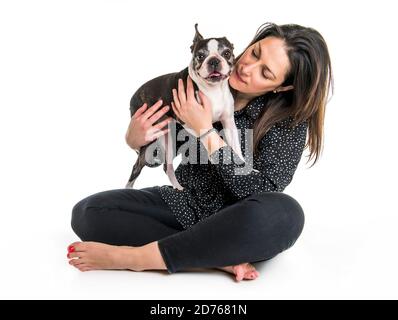 woman with is Boston Terrier on studio white background Stock Photo