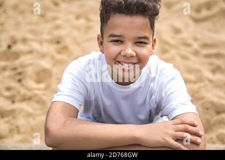 Teen afro american boy in the garden on the day time Stock Photo