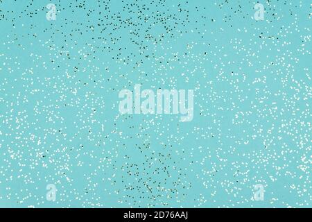 Blue Festive background texture with glittering silver confetti. Stock Photo