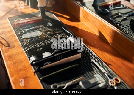 Collection of hairdressing tools on wooden desk Stock Photo