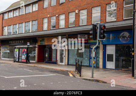 an empty high street deserted shops closed down during the corona virus covid 19 outbreak. Stock Photo