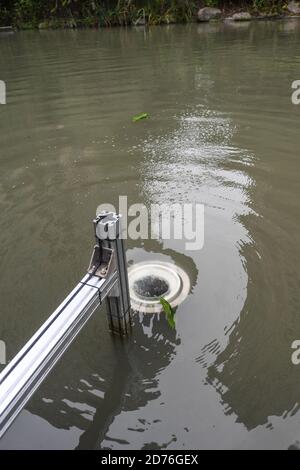 (201021) -- HANGZHOU, Oct. 21, 2020 (Xinhua) -- An automatic cleaning machine collects wastes in a river in Hangzhou, east China's Zhejiang Province, Oct. 21, 2020. A series of high-tech measures were applied to improve the river ecosystem in Hangzhou, including unmanned boats patrolling, automatic watercourse waste cleaning system, artificial intelligence (AI) monitoring system, etc. (Xinhua/Xu Yu) Stock Photo