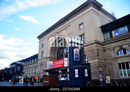 German people and foreign travelers walking in and out of building go to train at platform of Mannheim Hauptbahnhof railway train station at Mannheim Stock Photo