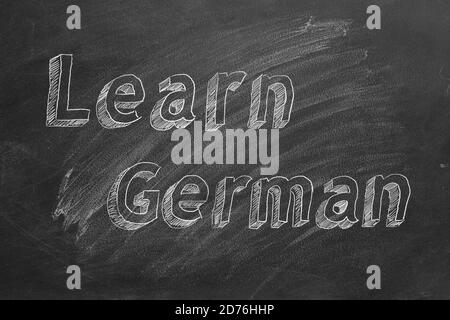 Hand drawing 'Learn German' on blackboard Stock Photo