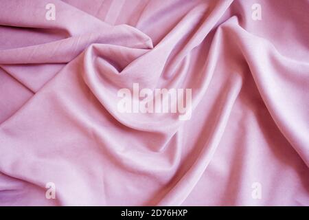 Pink velour pleats. Soft blackout curtains for the room. Fabric for tailoring Stock Photo