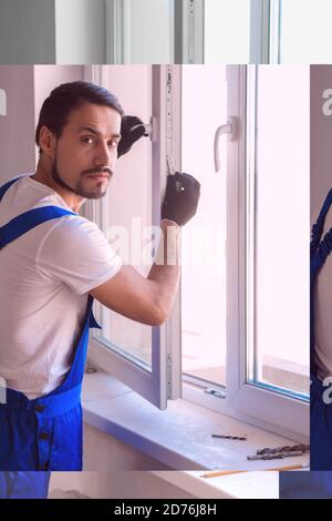 Man in blue uniform preparing to install a window Stock Photo