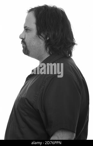 Profile view of overweight bearded man in black and white Stock Photo