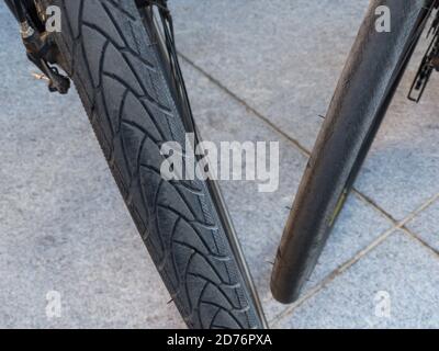 Top and close view of two bicycle  wheels with different types of (tires installed Stock Photo