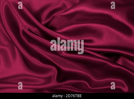 Smooth elegant pink silk or satin luxury cloth texture can use as abstract background. Luxurious background design Stock Photo