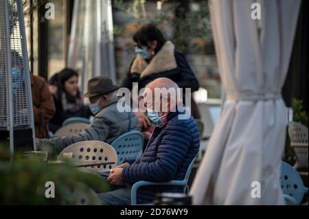terni,italy october 21 2020:man with medical mask sitting at the cafe in the city center Stock Photo
