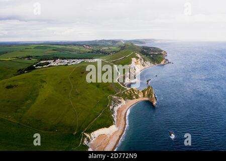 Aerial view wtih beautiful, UK England Europe Dorset Durdle Door Beach white cliff sunset Stock Photo