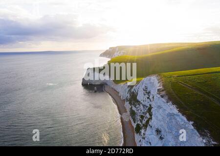 Aerial view wtih beautiful, UK England Europe Dorset Durdle Door Beach white cliff sunset Stock Photo