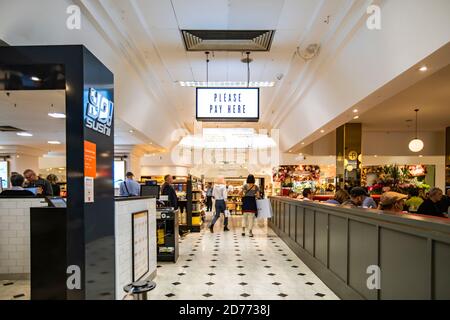 Selfridges food hall indoor store in London, UK, September 20, 2019: Please pay here sign inside a Selfridges food hall London uk. Stock Photo