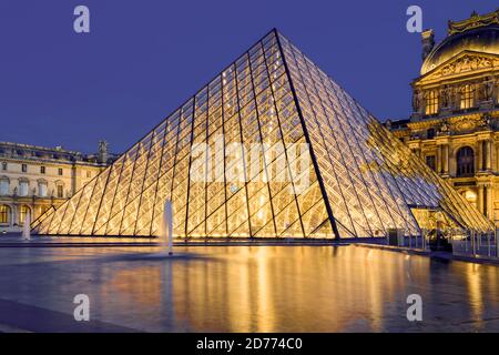 The Louvre pyramide at night Stock Photo