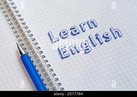 Learn English. Text handwritten on sheet of notebook Stock Photo