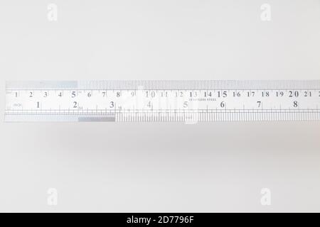 stainless steel ruler with inches and centimeters on white with copy space  Stock Photo - Alamy