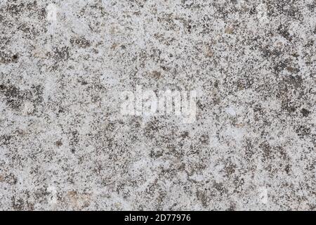Smooth concrete cement surface stained by weathering mildews etc. Only laid down about 3 years ago. Gritty concrete surface texture. Stock Photo